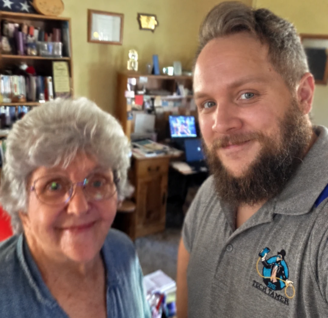 Josh, The Tech Tamer, with a client during a home visit