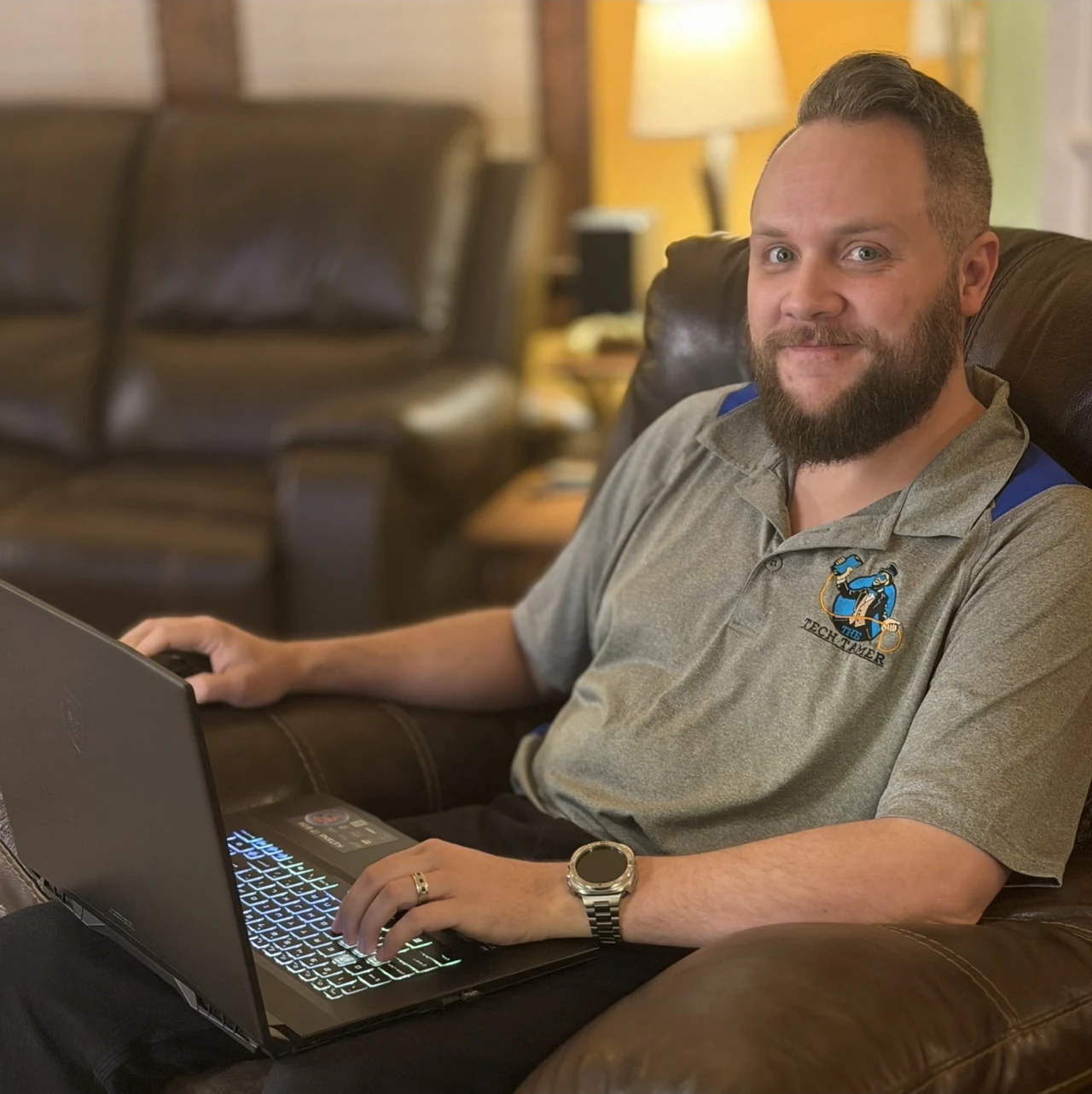 Josh Sargent in a Tech Tamer polo with a laptop on his lap—you don’t have to figure it out alone